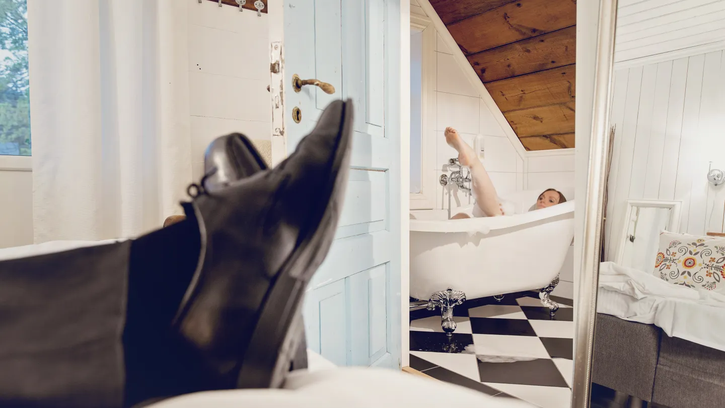 Guests enjoying the bath tub in one of the rooms at Haaheim Gaard