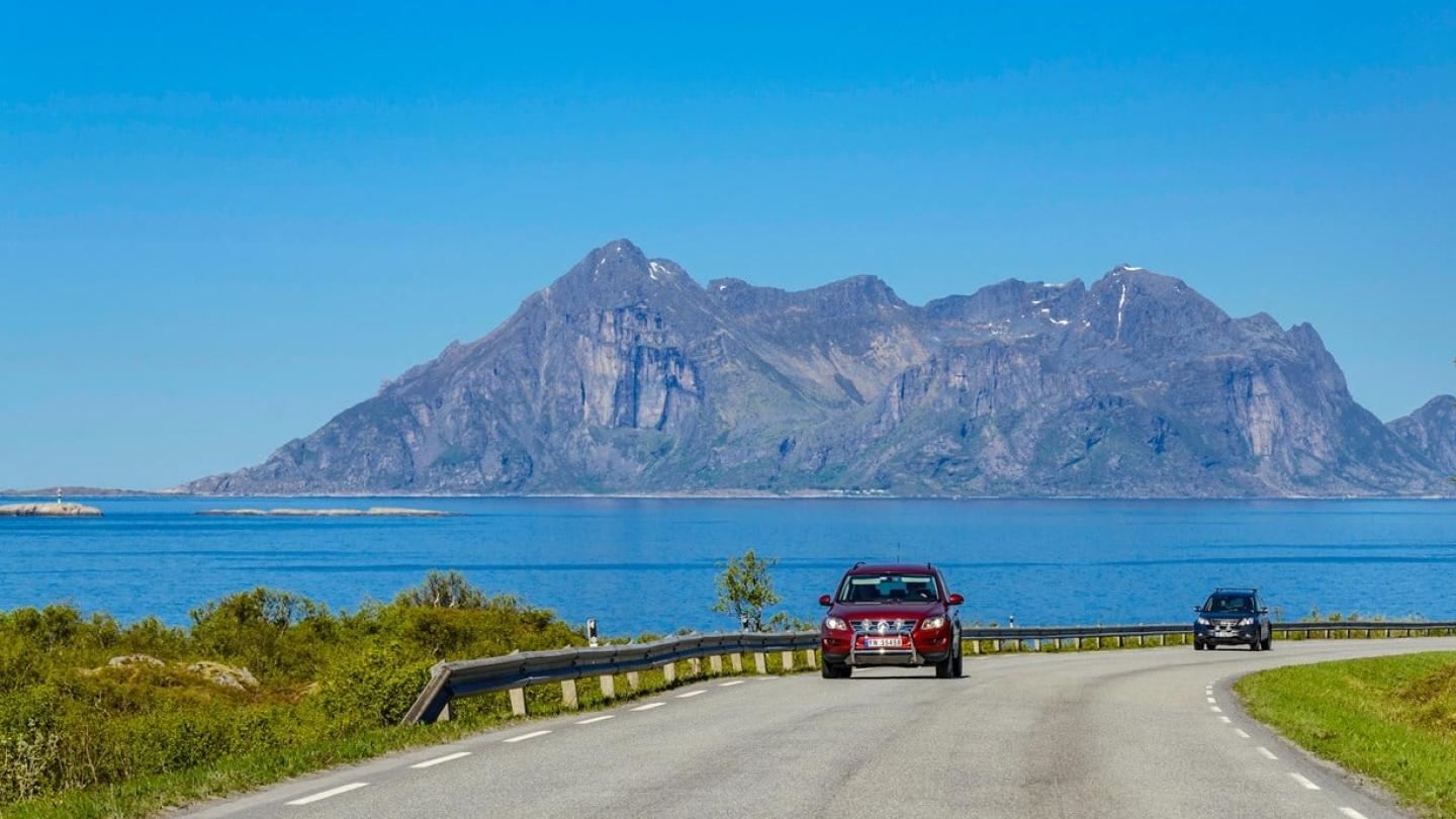 Cars driving along the Norwegian Scenic Route Helgelandskysten