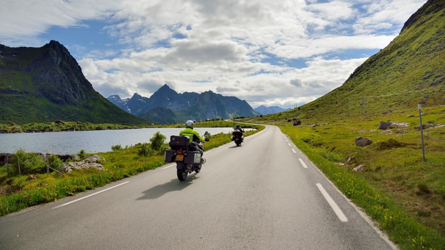 Motorcyclists riding along the Norwegian Scenic Route Lofoten