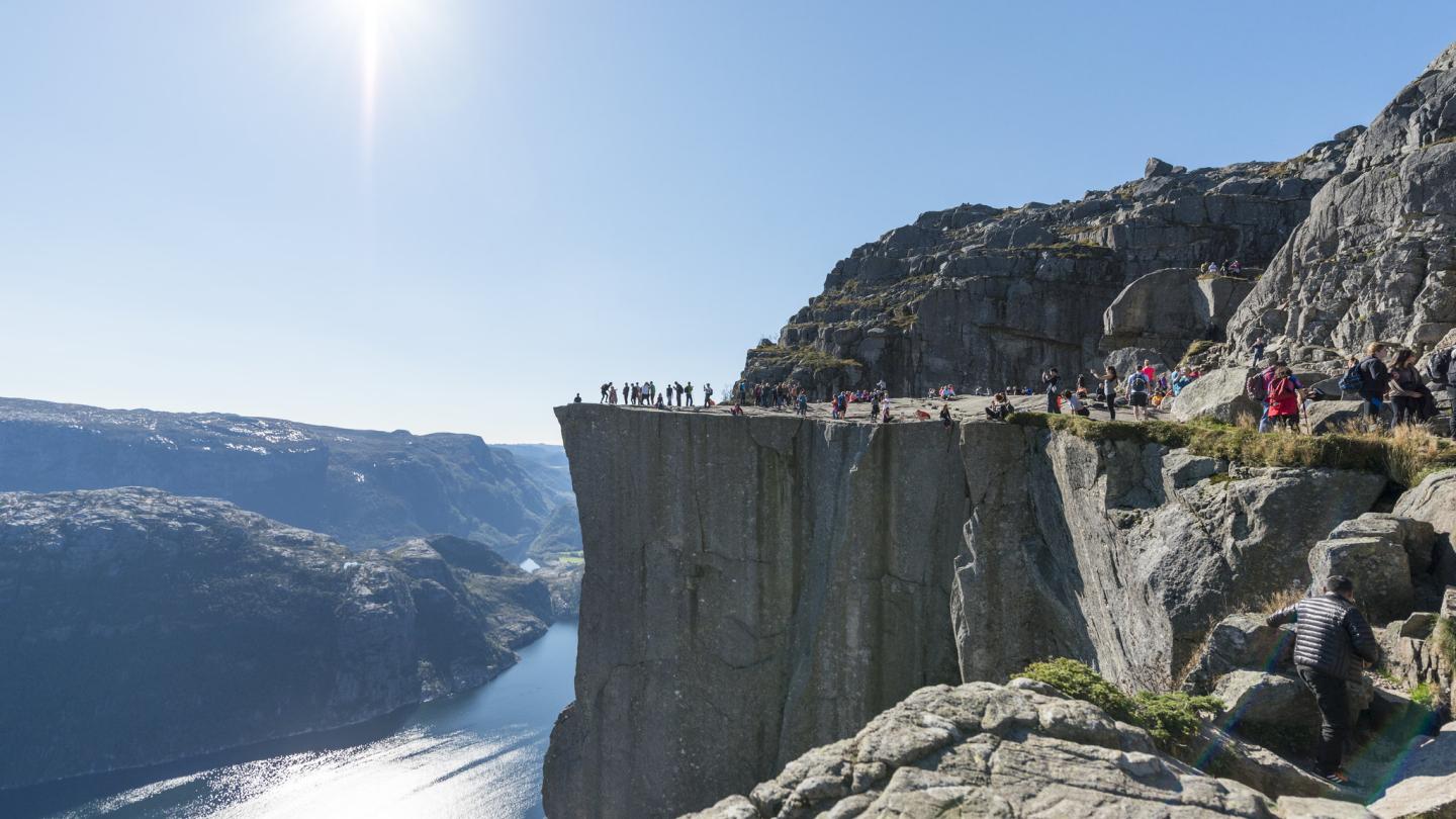 People enjoying the top of Preikestolen, the Pulpit rock, in sun