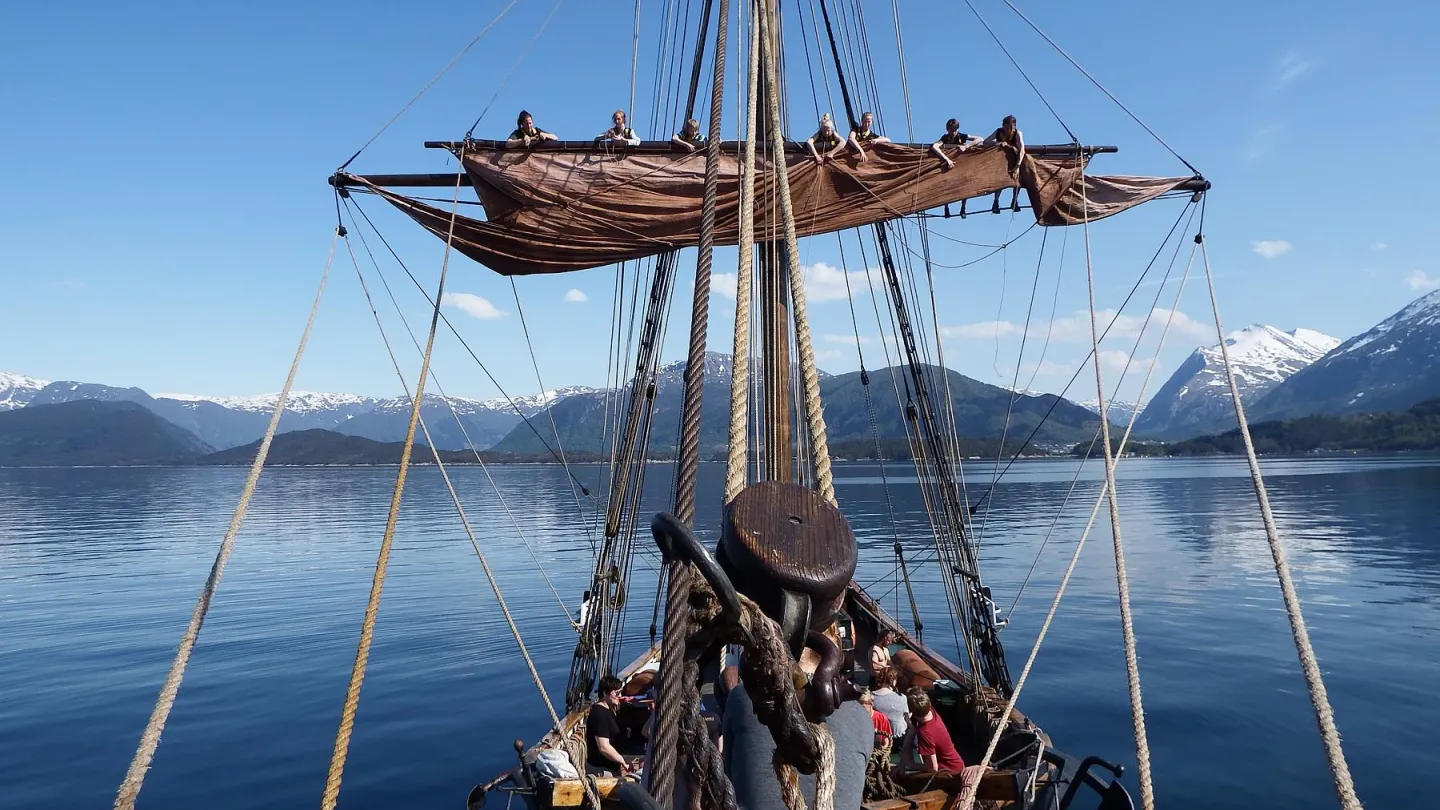 Mathilde sailing across the water. View from an old ship sailing on water, sunny.