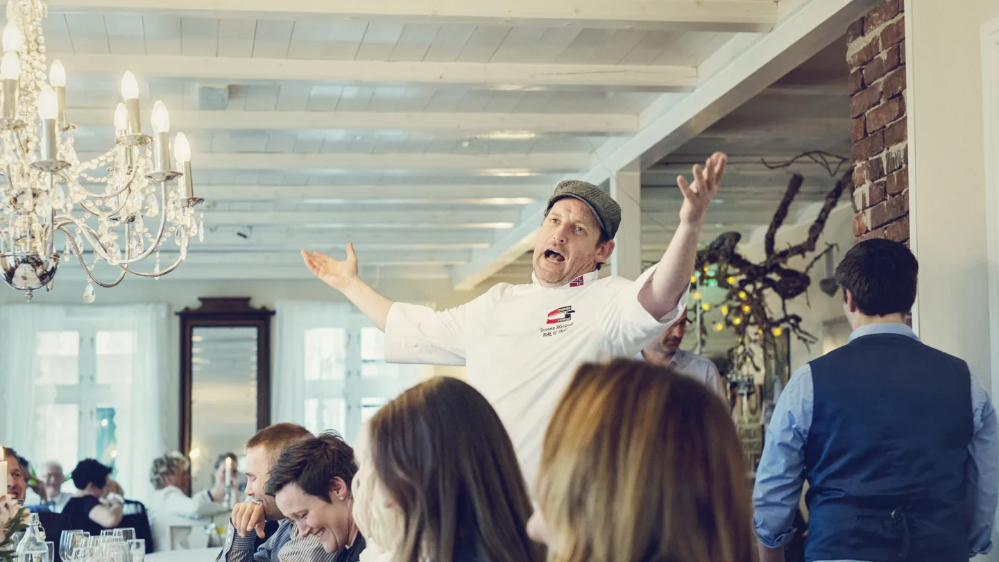 Torstein, the house father of Haaheim Gaard, entertaining his guests