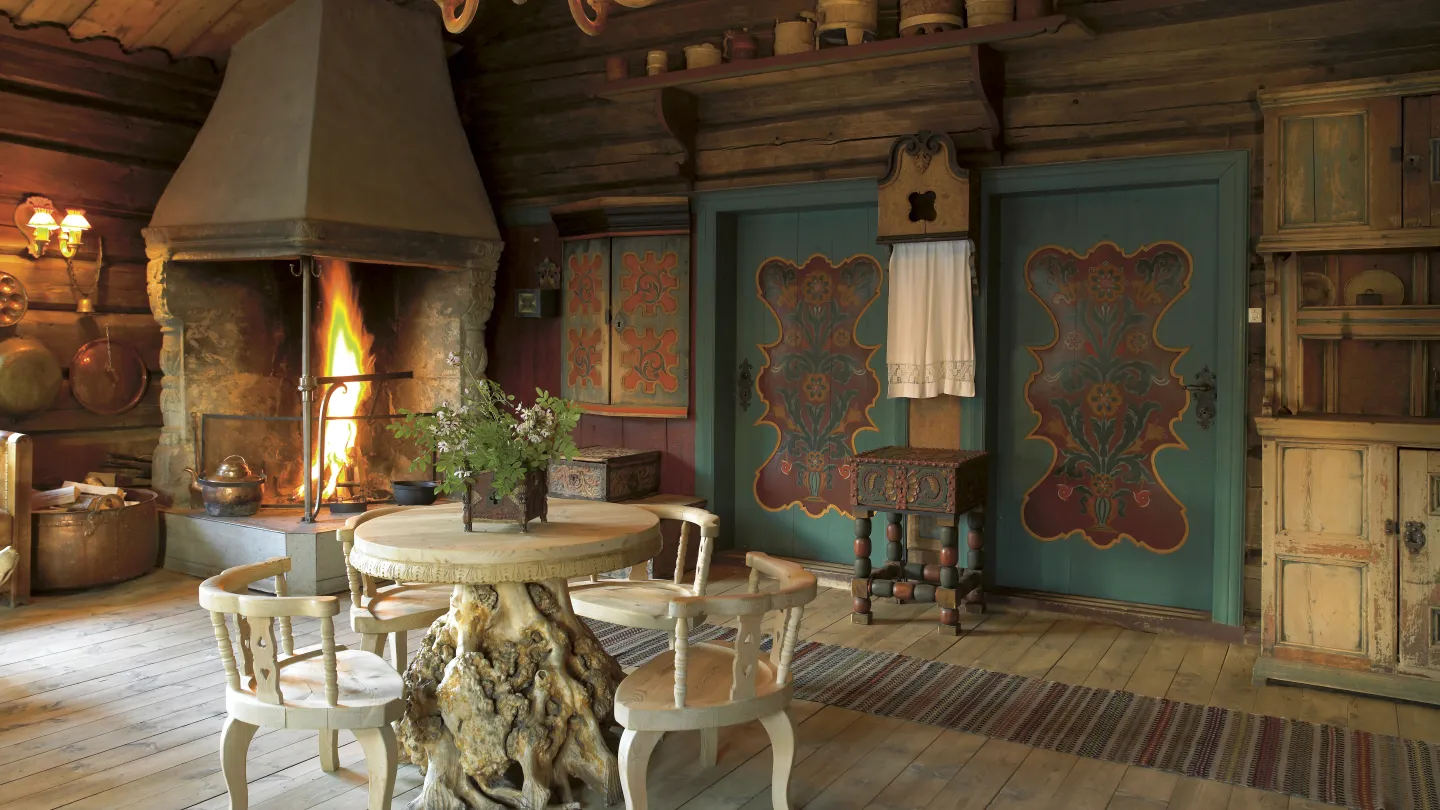 The fireplace in one of the common rooms at Fossheim Hotel