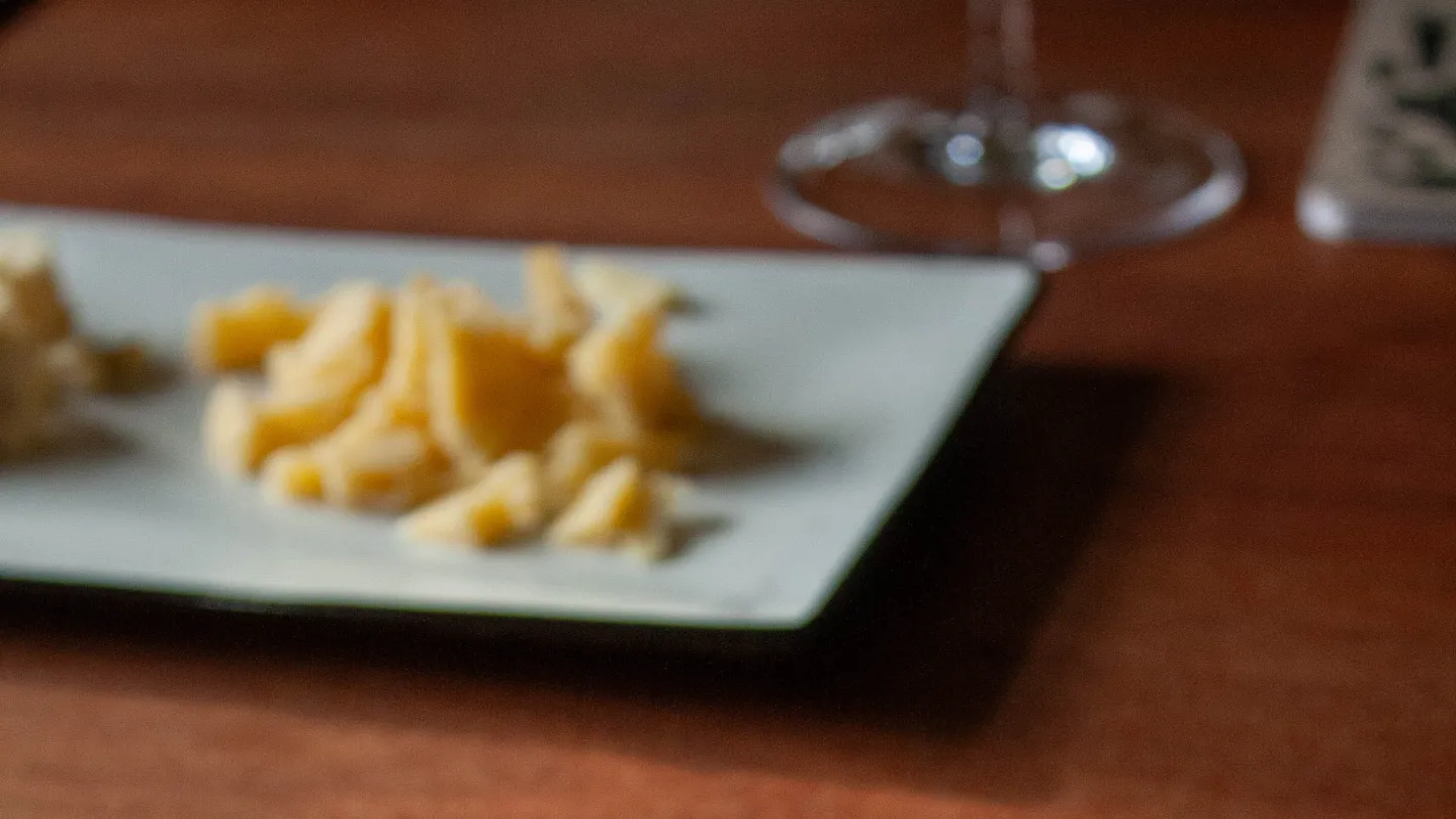 A notebook and some cheese on a table at Aga Sideri