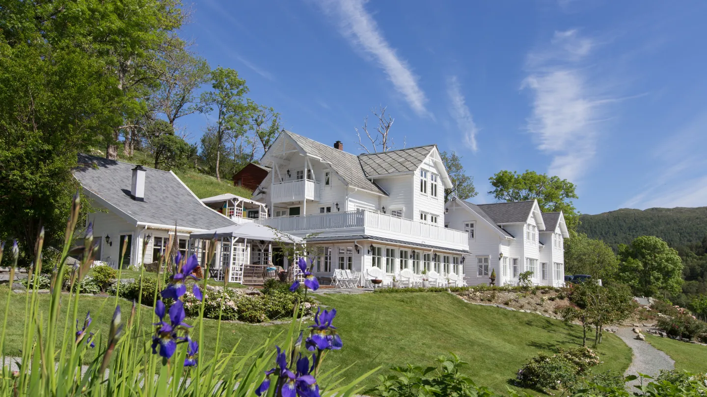 The exterior of Haaheim Gaard bathing in sunlight