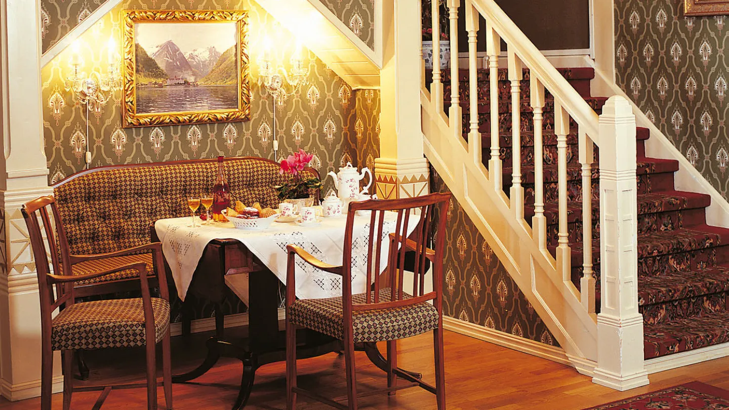 A corner in one of the common rooms of Kviknes Hotel set for a tea party.