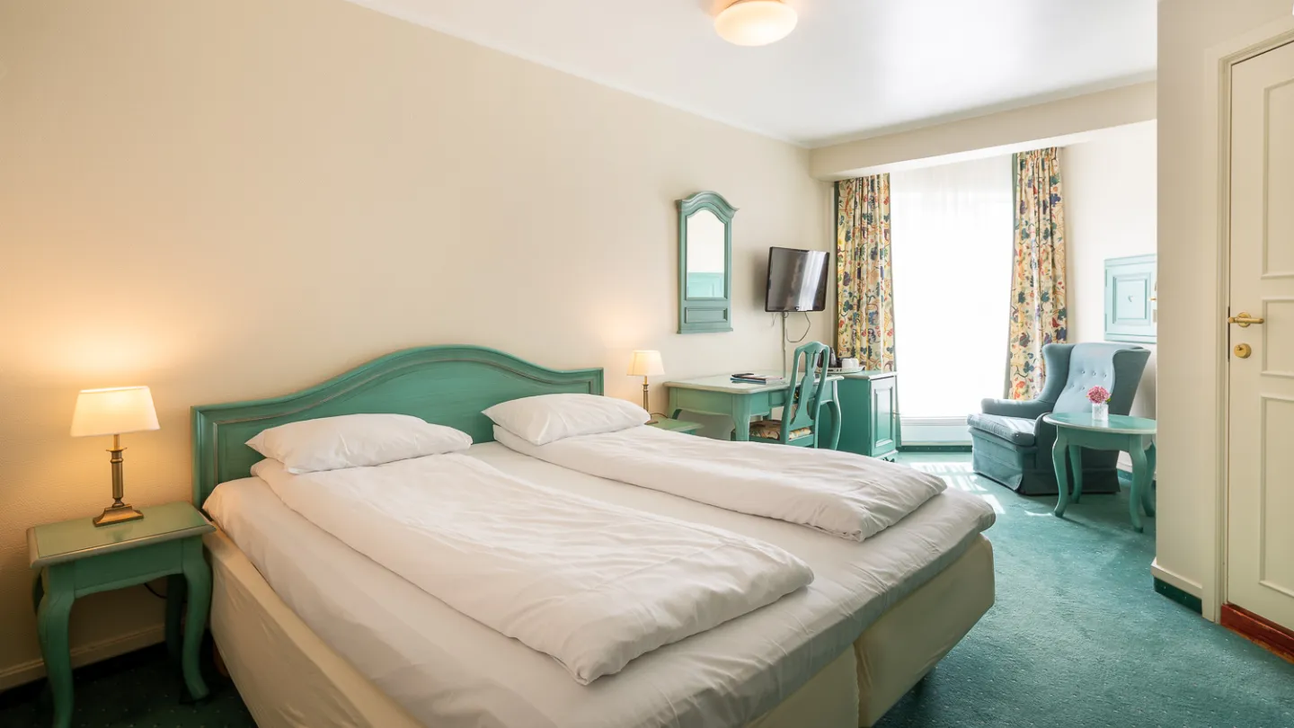 A bedroom at Lillesand Hotel norge