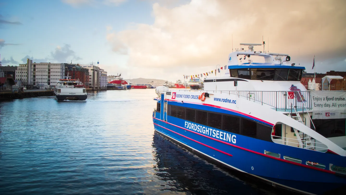 A boat from Rødne docked in Bergen, ready for a fjord sightseeing