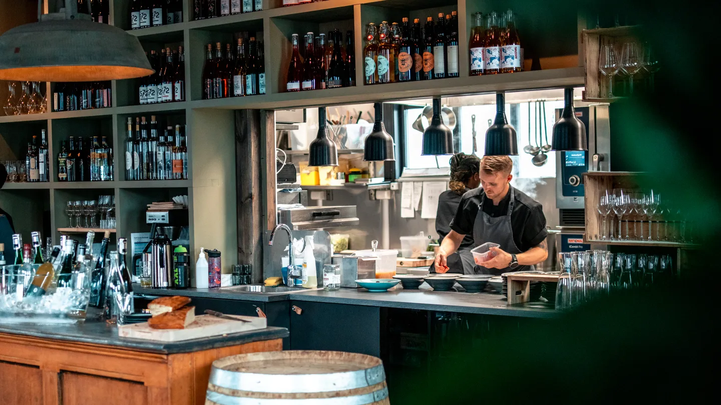 Chefs working behind the bar at Siderhuset Ola K