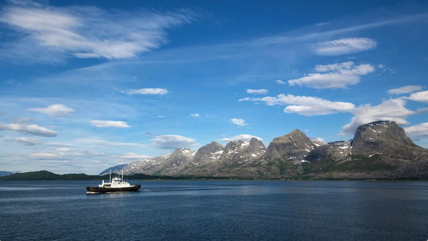 A ferry passing by the Seven Sisters mountain range